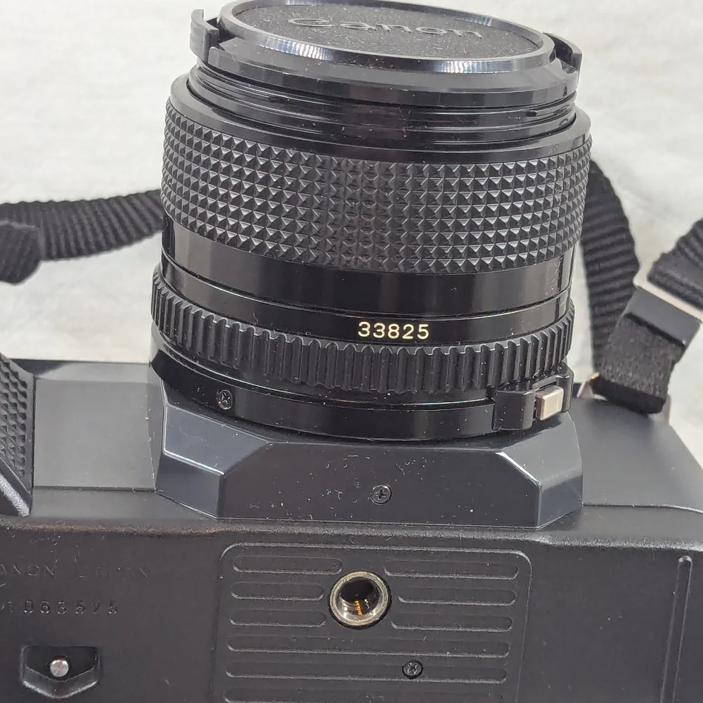 Vintage Canon T50 With Accessories And Polaroid Case